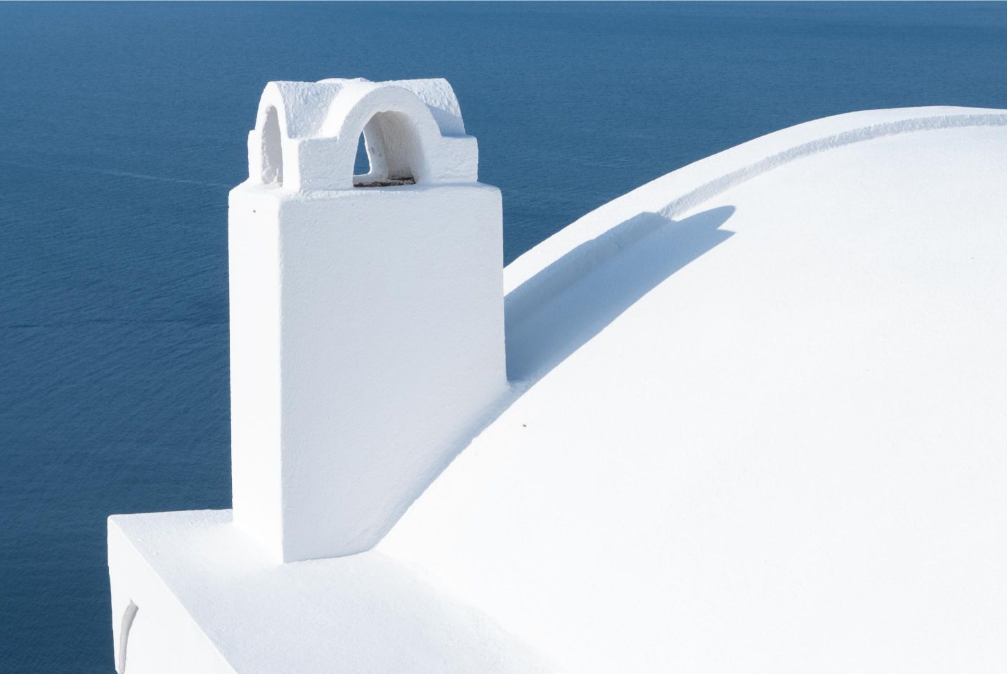 white detail of church against blue backdrop